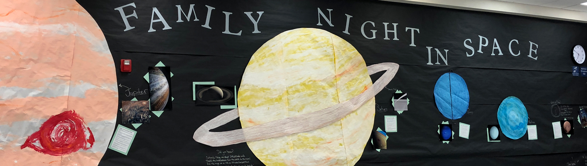 bulletin board that says Family night in space 